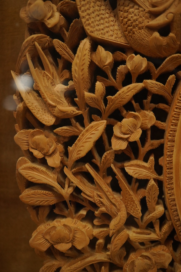 A pair of early 20th century, finely carved Chinese sandalwood photo frames, 30.5cmx24cm oval. Condition - good